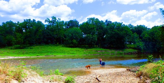 Broad view of the Lampasas River beach at River Bone Ranch