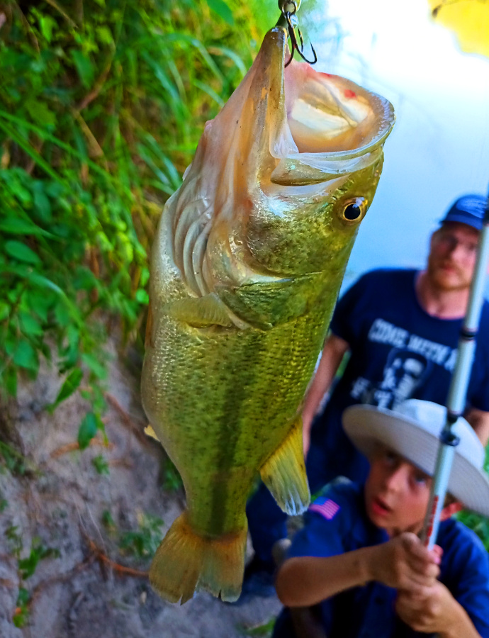 A Cadet catches a largemouth bass at River Bone Ranch